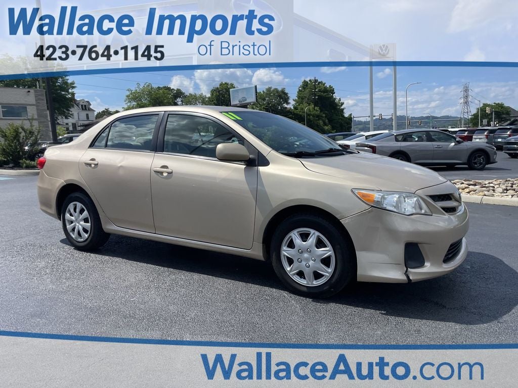 2011 Toyota Corolla LE in Sandy Beach Metallic — front three-quarter view