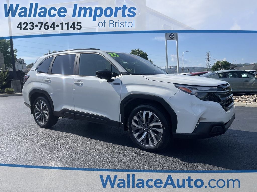 2025 Subaru Forester Hybrid Touring in Crystal White Pearl — front three-quarter view