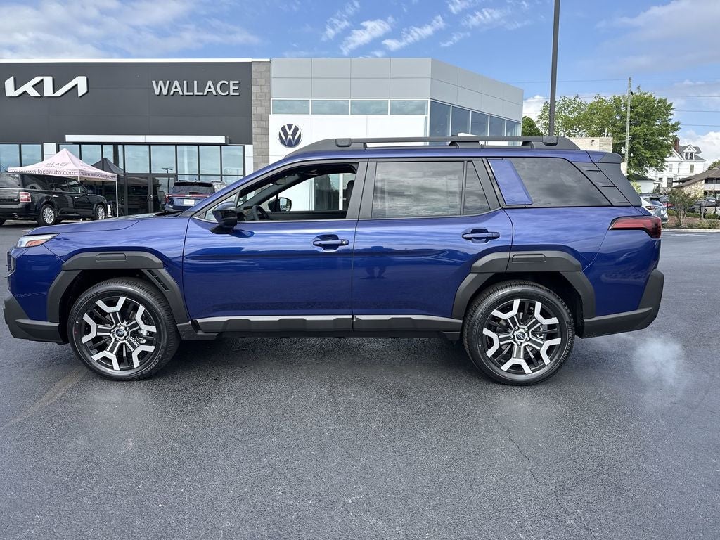 2026 Subaru OUTBACK Touring XT in Sapphire Blue Pearl — front three-quarter view