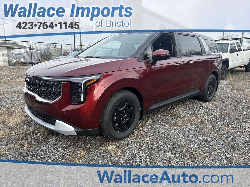 2026 Kia Carnival LXS in Flare Red — front three-quarter view