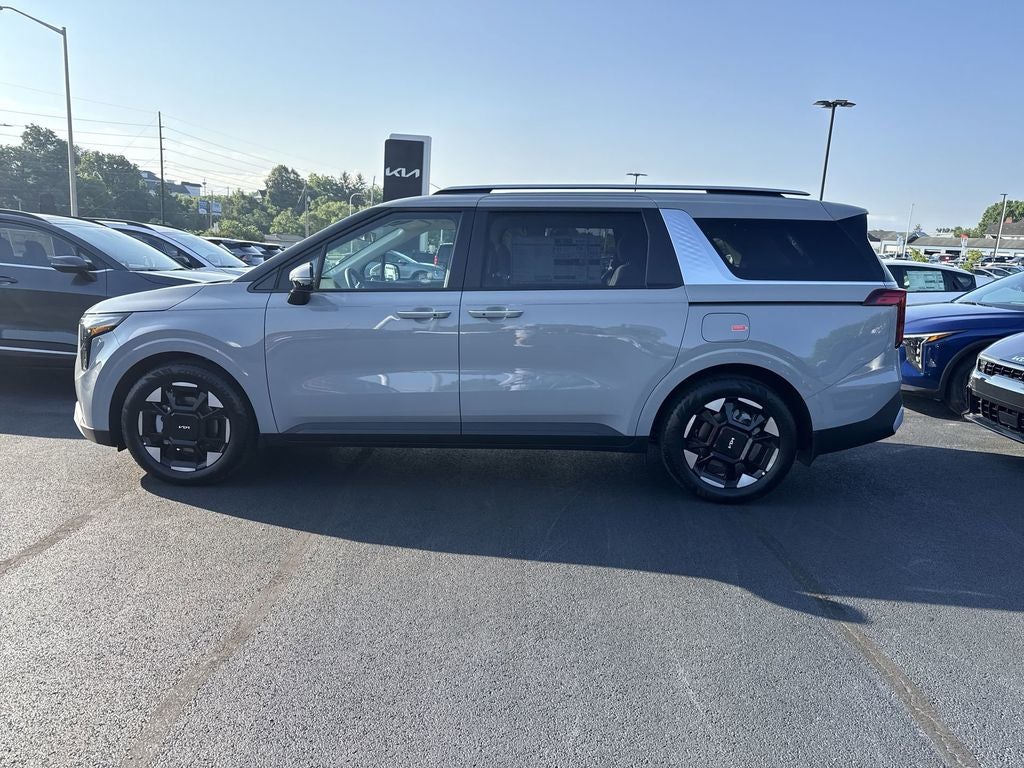 2026 Kia Carnival EX in Ceramic Silver — front three-quarter view